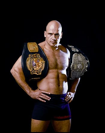 Bas Rutten with championship belts from his legendary fighting career