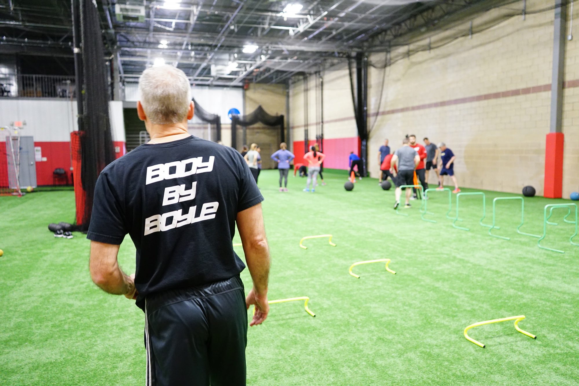 Athletes training on the turf at Body By Boyle Strength & Conditioning