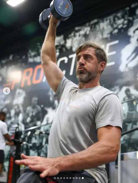 Aaron Rodgers performing single-arm dumbbell press at Proactive