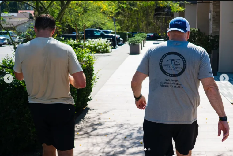 Drew Brees and Todd Durkin walking after workout