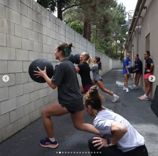 Todd Durkin coaching a med ball training session outdoors